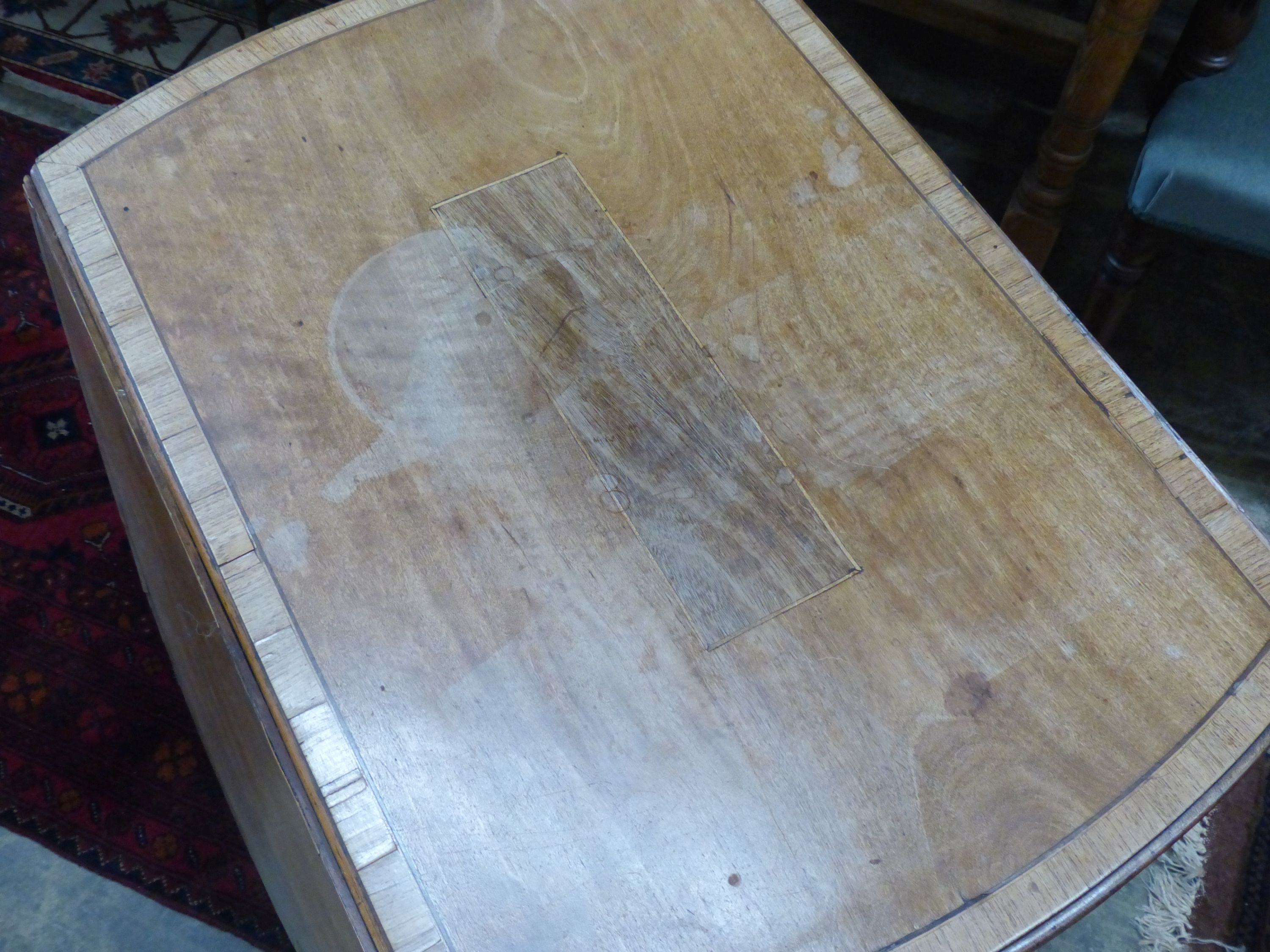 A George III mahogany oval pembroke table